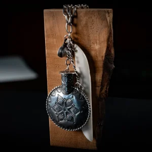 Necklace Hanging on a Piece of Wood